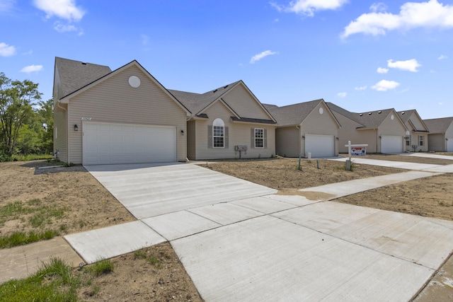 31421 Augusta Dr Unit 76, Romulus, MI 48174 - view of front facade featuring concrete driveway and a garage