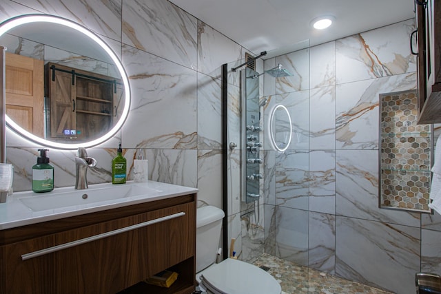 bathroom with vanity, toilet, tiled shower, and tile walls