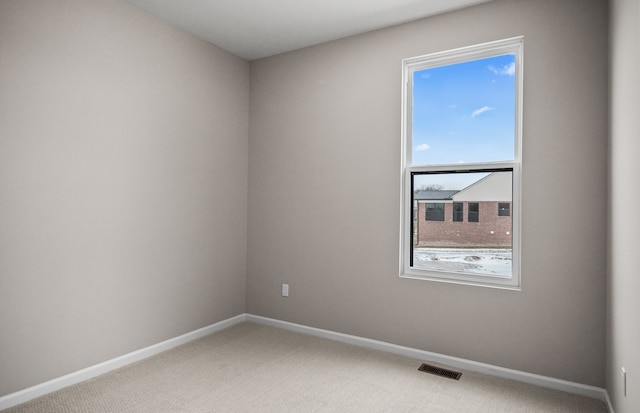 unfurnished room with carpet flooring