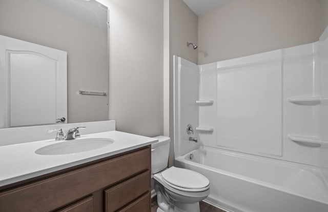 full bathroom featuring vanity, tub / shower combination, and toilet