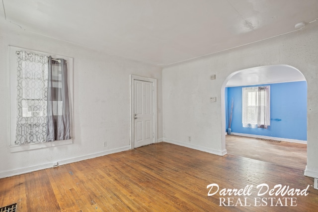 empty room featuring wood-type flooring