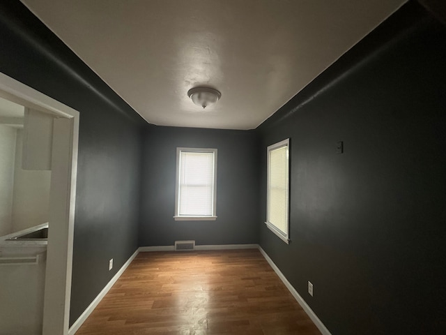 empty room featuring hardwood / wood-style flooring