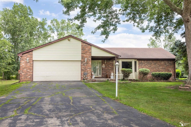 ranch-style home with a front yard and a garage