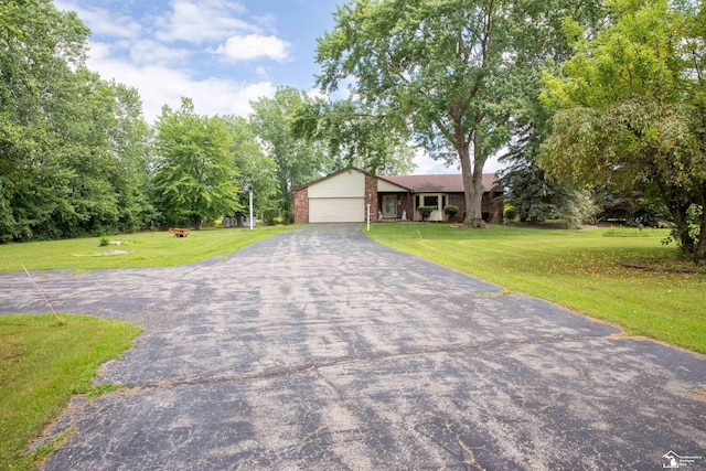 single story home with a front lawn and a garage