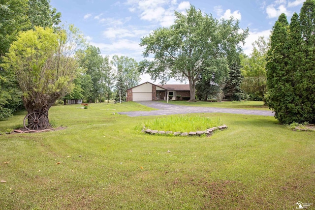 view of yard featuring a garage