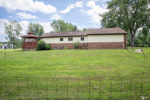 28237 W Huron River Dr, Huron, MI 48134 - back of house with a gazebo and brick siding