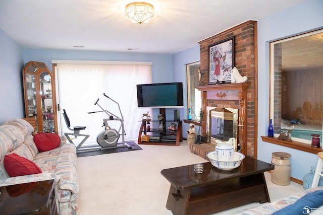 living room featuring a fireplace and carpet floors