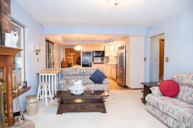 living room featuring light colored carpet