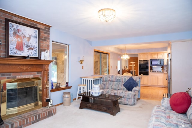 living room with a fireplace and light carpet