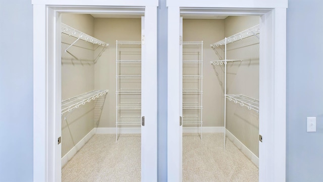 spacious closet with carpet floors