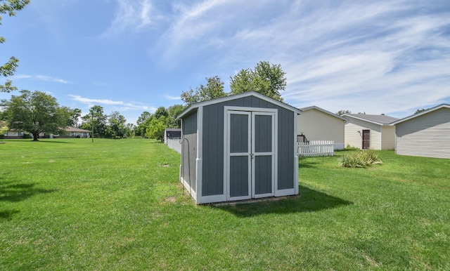 view of outdoor structure featuring a lawn