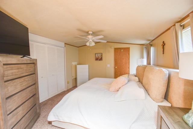 carpeted bedroom featuring ornamental molding, ceiling fan, and lofted ceiling