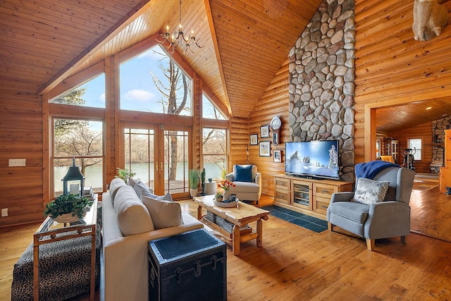 living room with hardwood / wood-style floors, high vaulted ceiling, french doors, wood ceiling, and a chandelier