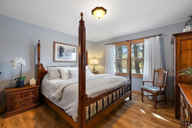 bedroom with hardwood / wood-style flooring