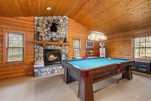 rec room featuring light colored carpet, wooden ceiling, a fireplace, and a wealth of natural light