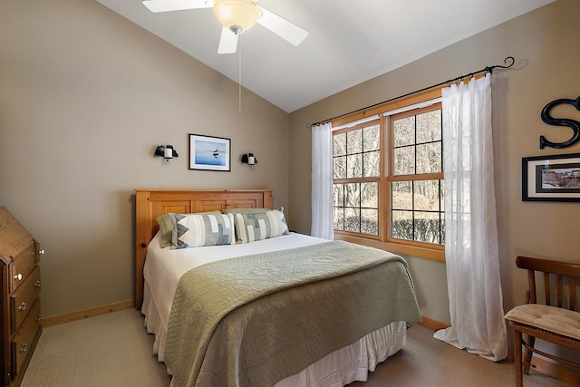 carpeted bedroom featuring ceiling fan and lofted ceiling