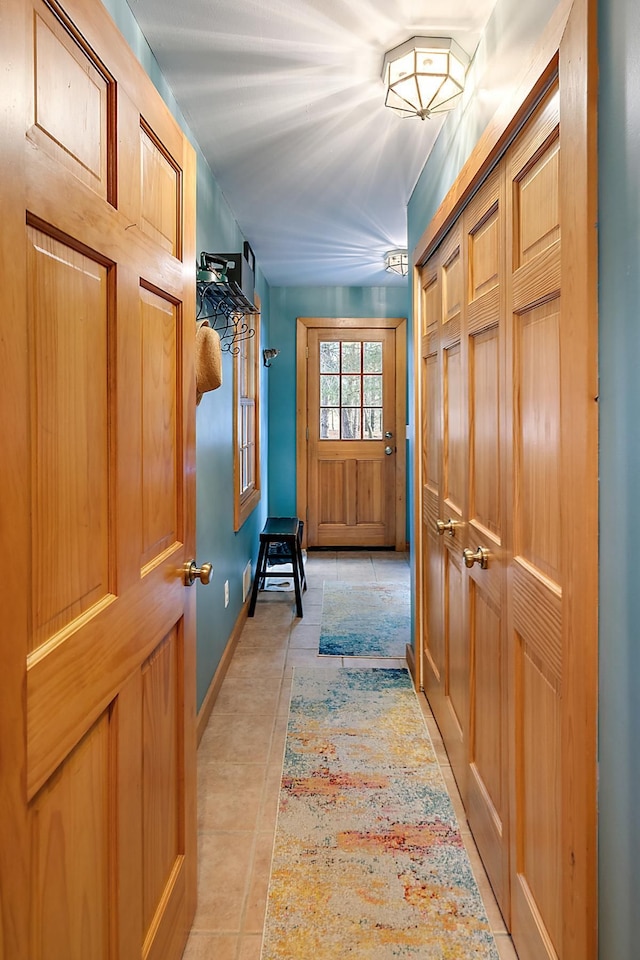 hallway with light tile patterned flooring