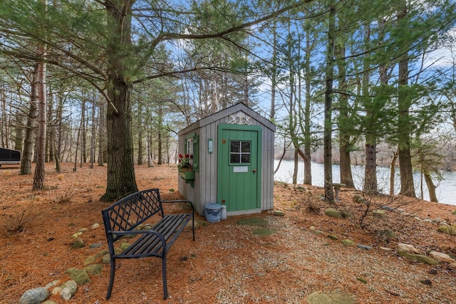 view of outbuilding with a water view