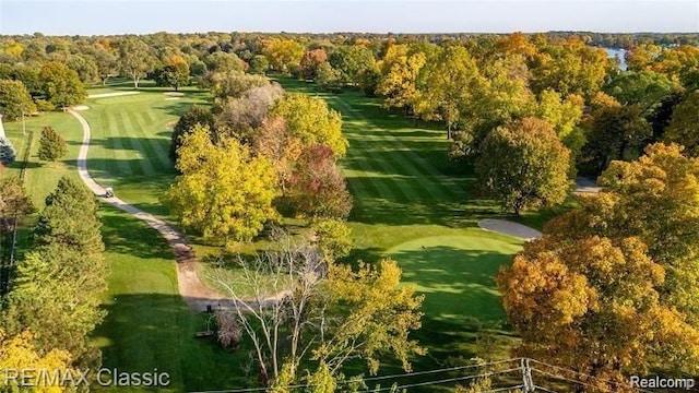 drone / aerial view with a wooded view