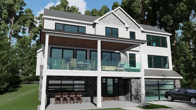 view of front facade featuring a garage, stone siding, board and batten siding, and a front yard