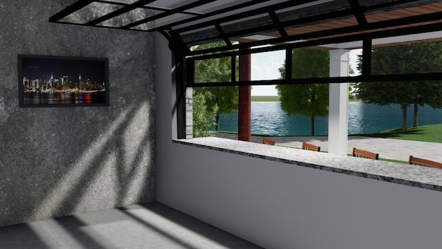 unfurnished sunroom with a water view