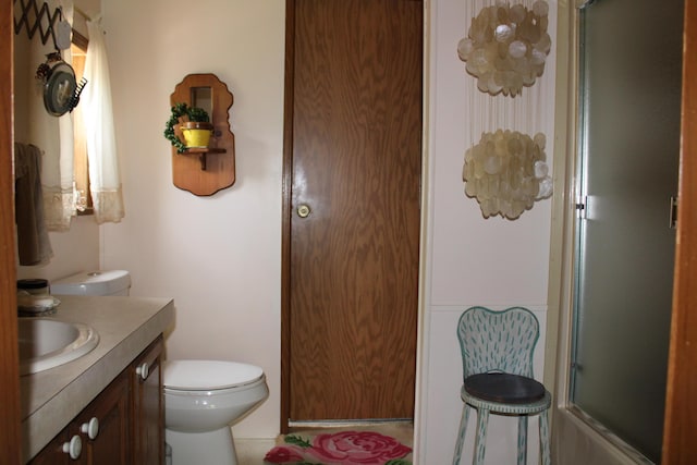 2802 Coulter Creek Trl, Central Lake, MI 49622 - bathroom with vanity, toilet, and walk in shower