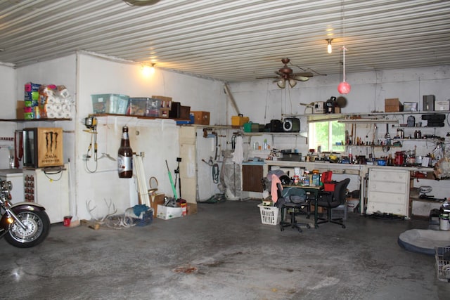 2802 Coulter Creek Trl, Central Lake, MI 49622 - garage featuring a workshop area and ceiling fan