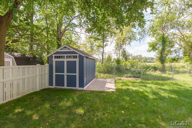 view of outbuilding featuring a yard