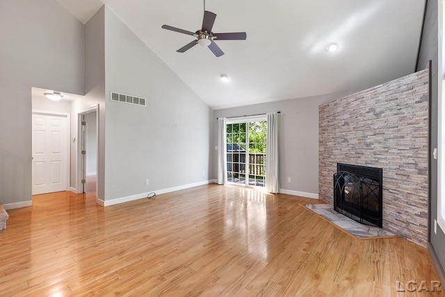 unfurnished living room featuring a fireplace, light wood-type flooring, high vaulted ceiling, and ceiling fan