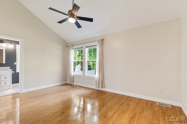 12171 Grandview Dr, Jerome, MI 49249 - unfurnished bedroom featuring light wood finished floors, baseboards, high vaulted ceiling, and ceiling fan