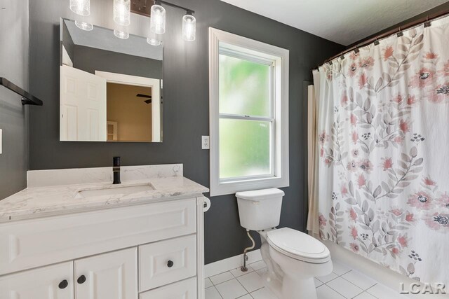 12171 Grandview Dr, Jerome, MI 49249 - full bathroom with toilet, vanity, tile patterned flooring, and healthy amount of natural light