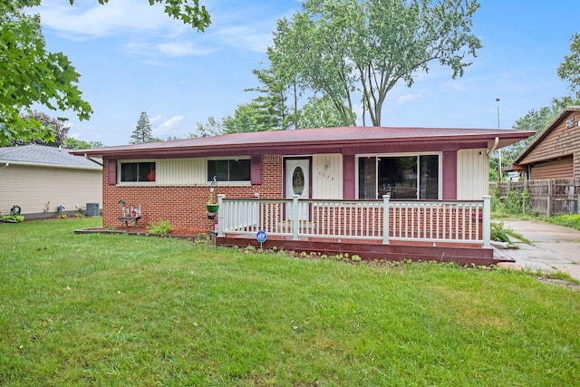 single story home featuring a front lawn and cooling unit