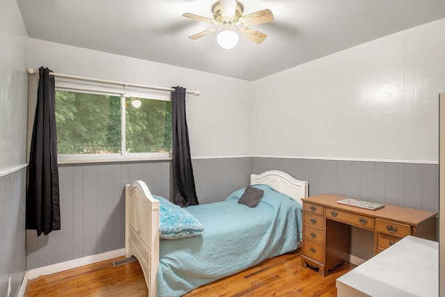 bedroom featuring light hardwood / wood-style floors and ceiling fan