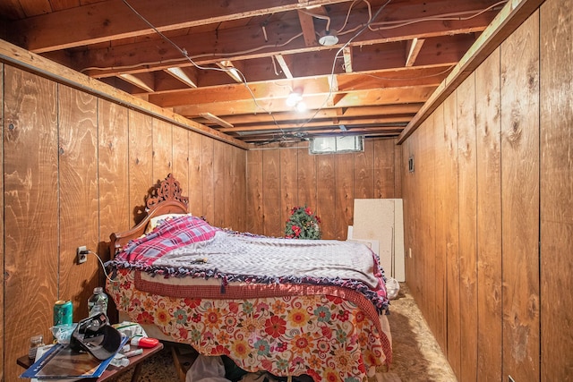 bedroom featuring wood walls