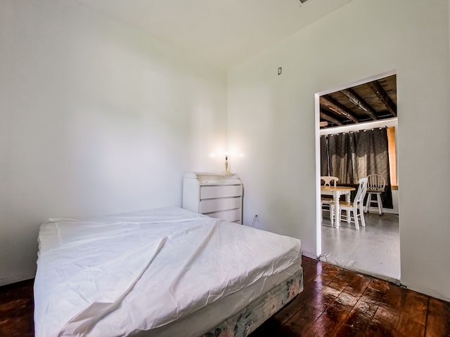 bedroom featuring dark wood-type flooring