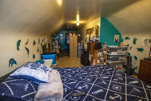 carpeted bedroom featuring fridge and vaulted ceiling