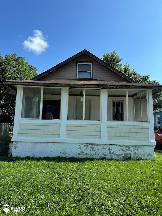 view of home's exterior featuring a yard