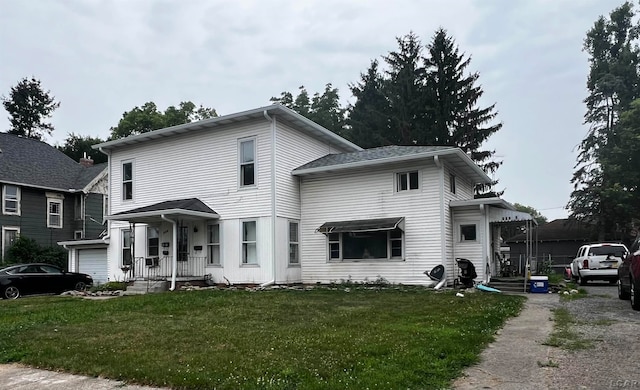 view of front property with a garage and a front lawn