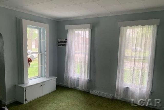 empty room with light carpet and crown molding