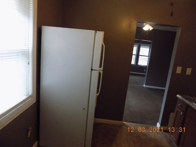 kitchen featuring white fridge and ceiling fan