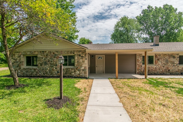 ranch-style home with a front lawn