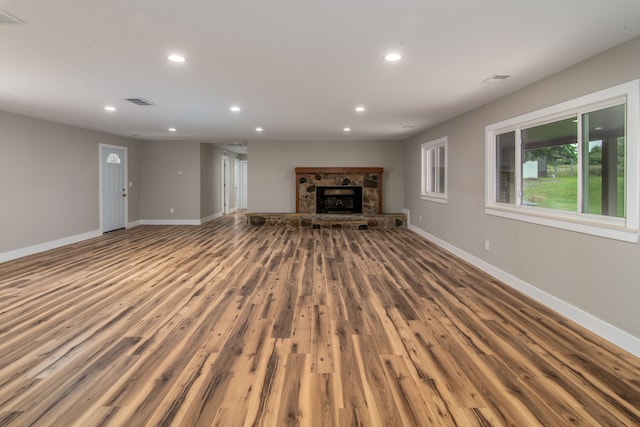 unfurnished living room featuring hardwood / wood-style flooring