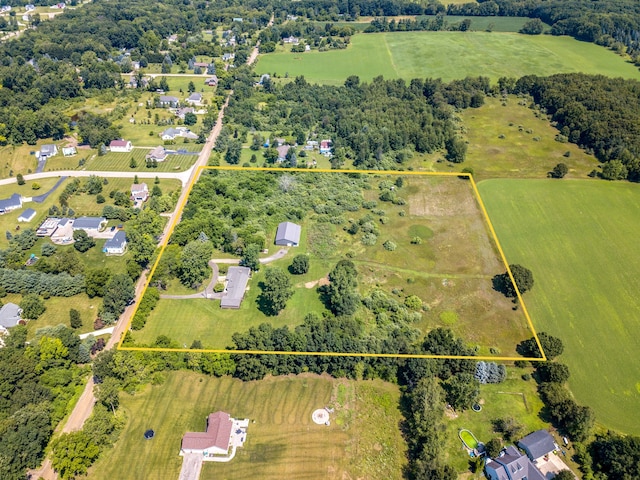 birds eye view of property featuring a rural view