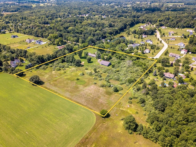 birds eye view of property with a rural view