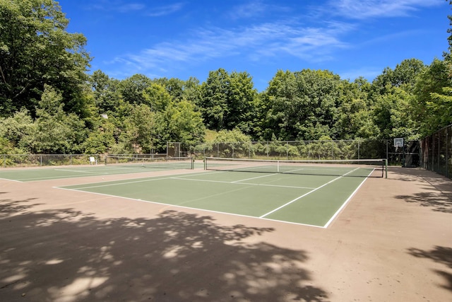 view of sport court with basketball hoop