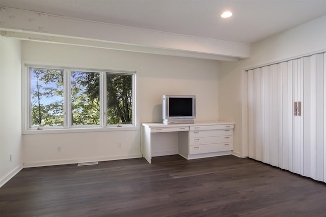 unfurnished office with dark hardwood / wood-style flooring