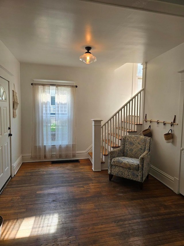 entrance foyer featuring dark hardwood / wood-style floors