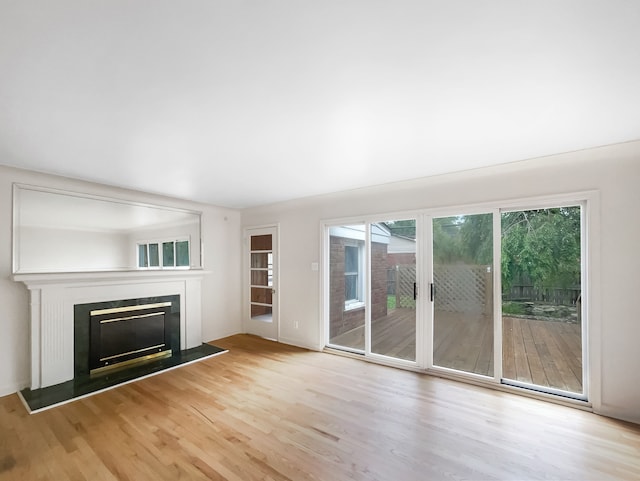 unfurnished living room featuring light wood-type flooring