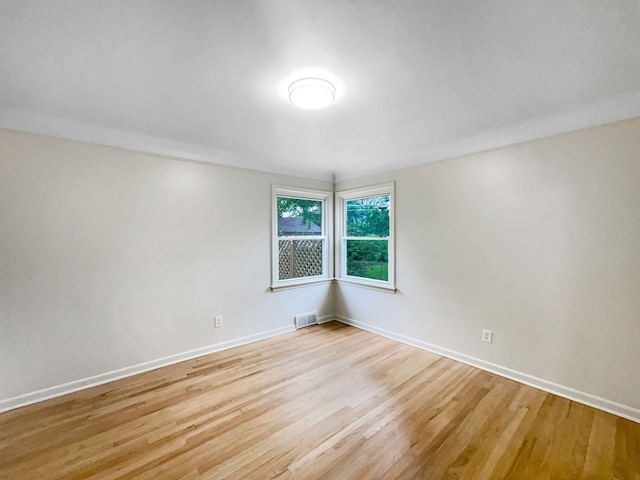 spare room featuring light hardwood / wood-style flooring