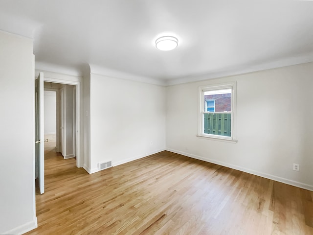 spare room featuring light wood-type flooring